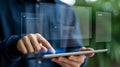 Close-up of hands using a tablet with a floating holographic interface displaying digital information Royalty Free Stock Photo