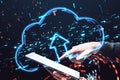 Close up of hands using tablet with glowing cloud with arrow on blurry dark background. Database and server concept. Double Royalty Free Stock Photo