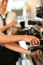 Close up hands waitress make coffee Royalty Free Stock Photo