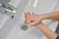 Close up of hands washing with soap. Washing hands with soap under the faucet with water. Clean and hygiene concept Royalty Free Stock Photo