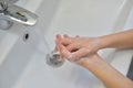 Close up of hands washing with soap. Washing hands with soap under the faucet with water. Clean and hygiene concept Royalty Free Stock Photo