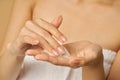 Close up of hands of woman preparing to apply gentle foam facial cleanser Royalty Free Stock Photo