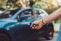 Close up hands woman pressing remote systems key near car Royalty Free Stock Photo