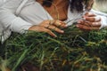 Close up of hands of the woman touching the grass, feeling nature Royalty Free Stock Photo