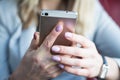 Close up of hands woman using cell phone Royalty Free Stock Photo