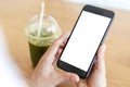 Close up hands of woman using mobile phone, cell phone in coffee shop. Hands of women holding blank empty screen smart phone in Royalty Free Stock Photo