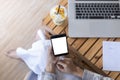 Close up hands of woman using mobile phone, cell phone in coffee shop. Hands of women holding blank empty screen smart phone in Royalty Free Stock Photo