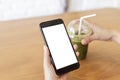 Close up hands of woman using mobile phone, cell phone in coffee shop. Hands of women holding blank empty screen smart phone in Royalty Free Stock Photo