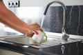 Close up hands of woman washing dishes Royalty Free Stock Photo