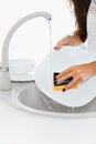 Close up hands of woman washing dishes in the kitchen Royalty Free Stock Photo