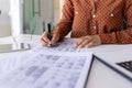 Close-up of hands of a woman working in the office at the table, signing business papers, working with documents Royalty Free Stock Photo