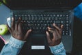 Young african woman typing on the laptop keyboard Royalty Free Stock Photo