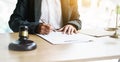 Close up hands of young lawyer signed the signature on the legal documents Royalty Free Stock Photo