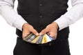 Close up hands young man wearing suit holding many bank card, credit card isolated on white background. Business online shopping Royalty Free Stock Photo