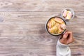 Close up hands of young woman female with manicure holding a cup of hot cocoa with marshmallow or coffee. Holiday Food Drink morni