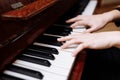 Close up of the hands of a young woman playing piano Royalty Free Stock Photo