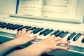 Close up of the hands of a young woman playing piano Royalty Free Stock Photo