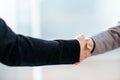 Close up. handshake of business people on the background of a bright office Royalty Free Stock Photo