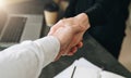 Close-up of handshake of businessman and businesswoman. Man`s hand shakes woman`s hand.Successful conclusion transaction Royalty Free Stock Photo