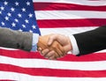 Close up of handshake over american flag