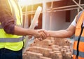 Close up of Handshake, Professional male civil engineer or Architect with contractor, foreman worker.