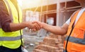 Close up of Handshake, Professional male civil engineer or Architect with contractor, foreman worker.