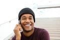 Close up handsome african american man smiling and talking with mobile phone Royalty Free Stock Photo