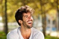 Close up handsome man with beard laughing outside Royalty Free Stock Photo