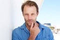 Close up handsome man leaning on wall and staring Royalty Free Stock Photo