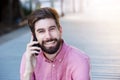 Close up handsome man talking on mobile phone outside Royalty Free Stock Photo