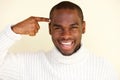 Close up handsome young black man with finger pointing to head Royalty Free Stock Photo