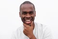 Close up handsome young black man smiling with hand to chin Royalty Free Stock Photo
