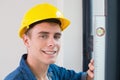 Close up of a handyman using a spirit level Royalty Free Stock Photo