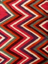 Close up of a hanged colourful handmade traditional wool rug