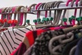 Close up on hangers with various women clothing in charity thrift shop Royalty Free Stock Photo