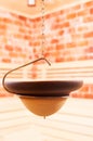 Close-up of hanging bowl in salty sauna