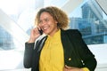 Close up happy african american business woman talking with cellphone in city Royalty Free Stock Photo