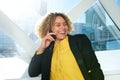 Close up happy african american business woman talking on mobile phone in city Royalty Free Stock Photo