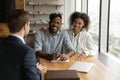 Close up happy African American couple listening to manager advisor Royalty Free Stock Photo