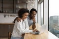 Close up happy African American couple using laptop together Royalty Free Stock Photo