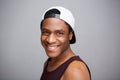 Close up happy african american man with cap against gray background Royalty Free Stock Photo