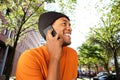 Close up happy african american man talking with mobile phone in city Royalty Free Stock Photo