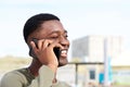 Close up happy african american man talking on smart phone outdoors Royalty Free Stock Photo
