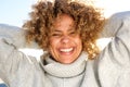 Close up happy african american woman laughing with hands behind head Royalty Free Stock Photo