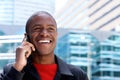 Close up happy african guy talking on mobile phone Royalty Free Stock Photo