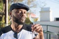 Close-up of happy African man holding glass of wine Royalty Free Stock Photo