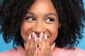 Close up of happy biracial girl. Laughing dark skinned millennial woman looking away. Cute positive mixed race female smiling,