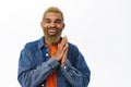 Close up of happy black man clap hands, applause and laughs, stands over white background Royalty Free Stock Photo