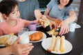 Close-up. Happy breakfast of a large family in the kitchen. Siblings, parents and children, mother and grandmother Royalty Free Stock Photo