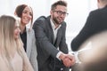 Close up. happy business people greet each other with a handshake Royalty Free Stock Photo